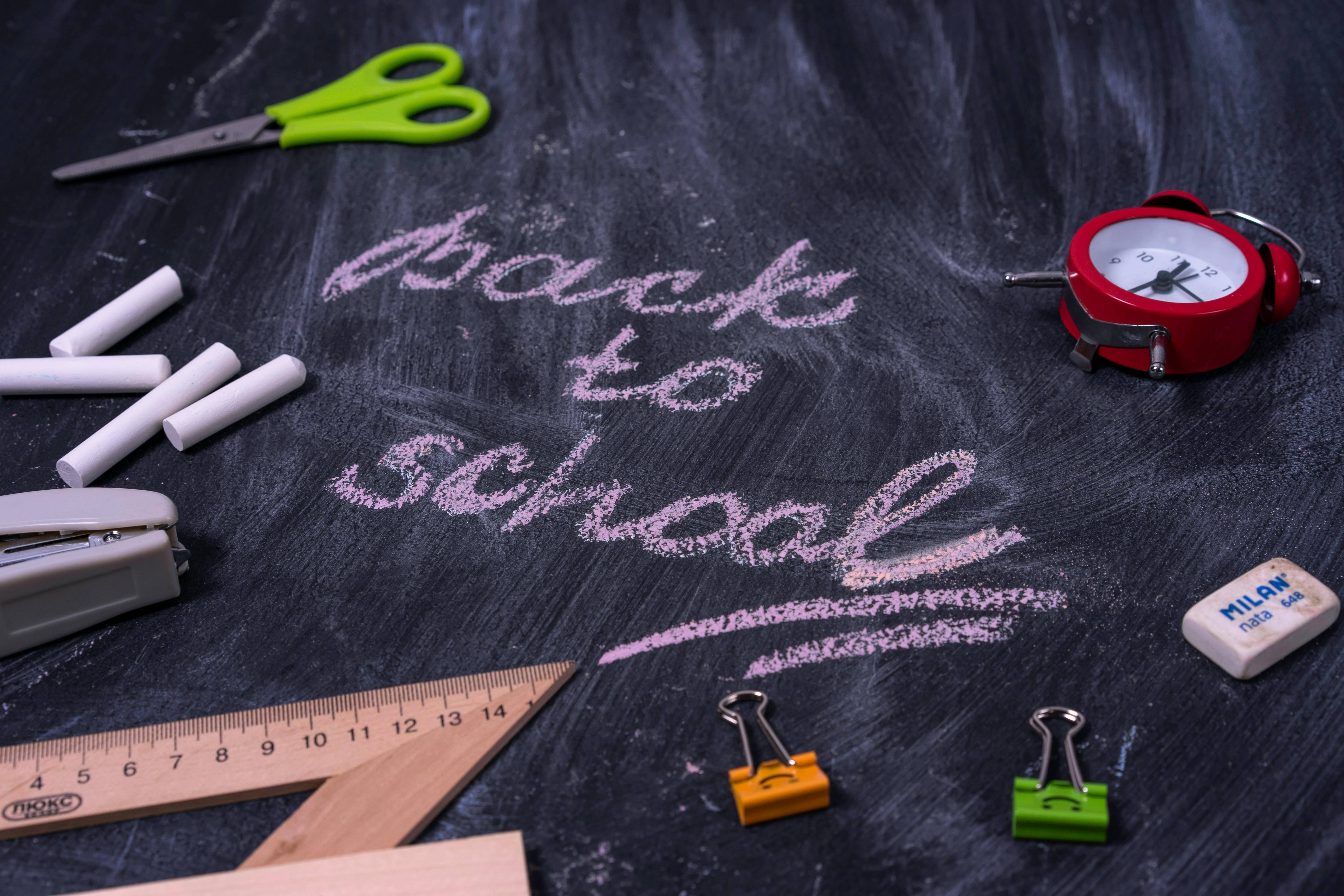 back to school written on a classroom chalkboard